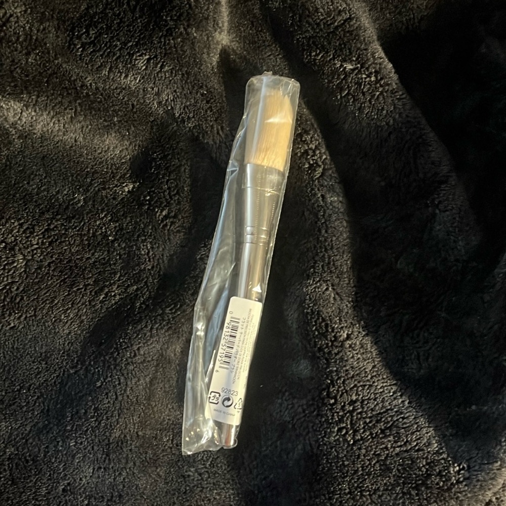 Brand new and unused bareMinerals flat tapered powder brush with gold handle.